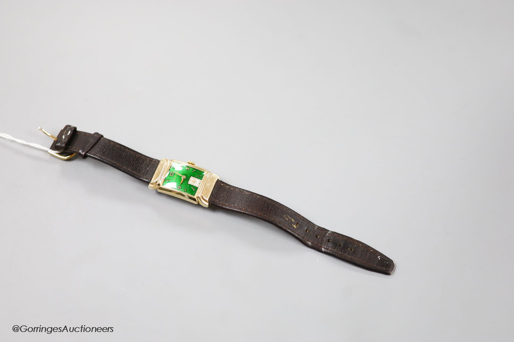 A gentleman's 1930's 10k gold filled Bulova manual wind wrist watch, with green enamel rectangular dial and subsidiary seconds, on later leather strap.